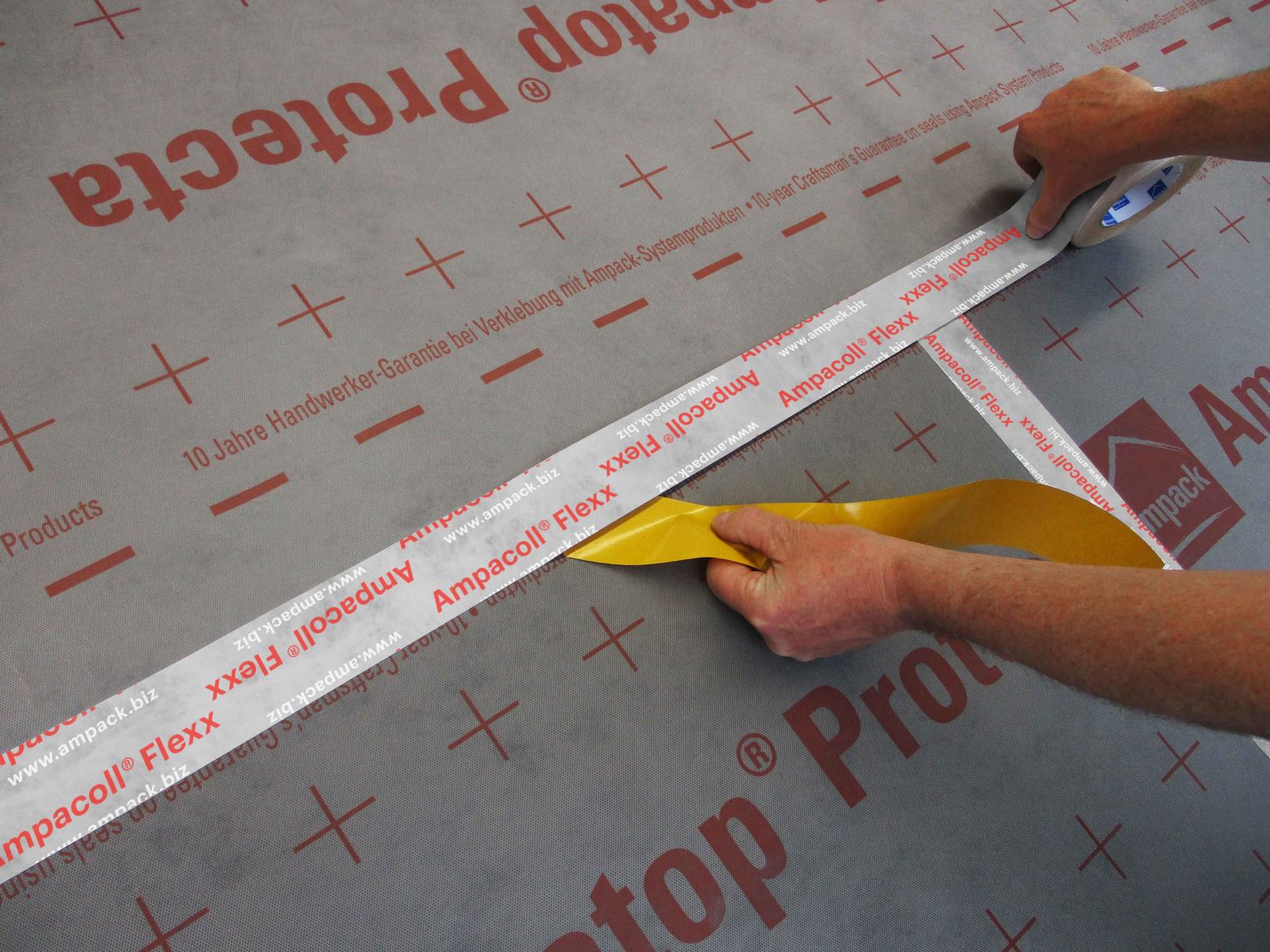 Material in action.

In this image you can see the Ampacoll Flexx tape being used for joining laps in one of the Ampatop breather membranes. The tape will stick tightly to fleecy membranes such as this and its soft, pliable nature means it is easy to work with on membranes laid directly on soft insulation.

Airtightness tapes are designed to be able to move and having wrinkles and creases in a membrane tends to very slowly separate the two layers. This is not the fault of the tape is it needs to be able to move with the building and is not designed to resist any tension between the two layers of membrane.

If you’re unsure of how to instal membranes or how to lap them effectively, please contact us.